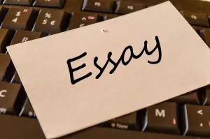 Student writing a college essay